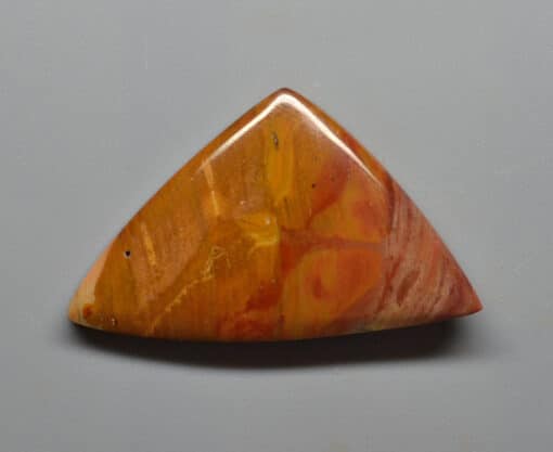 A triangle shaped piece of agate.