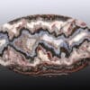 A round piece of agate with a pattern on it.