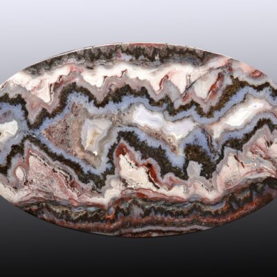 A round piece of agate with a pattern on it.