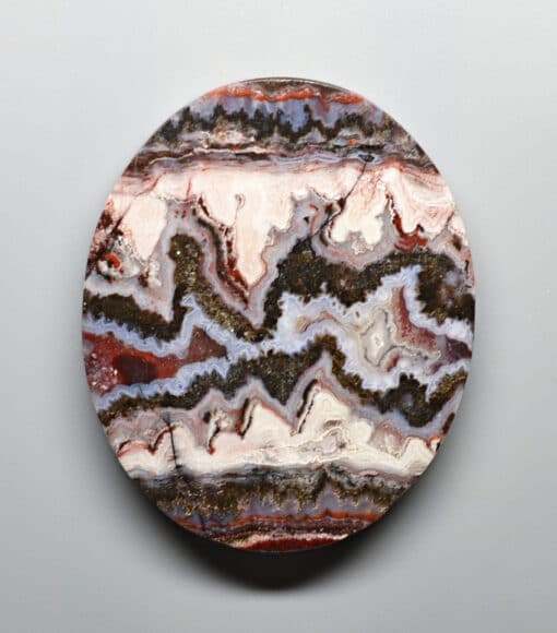 A round piece of agate on a white background.