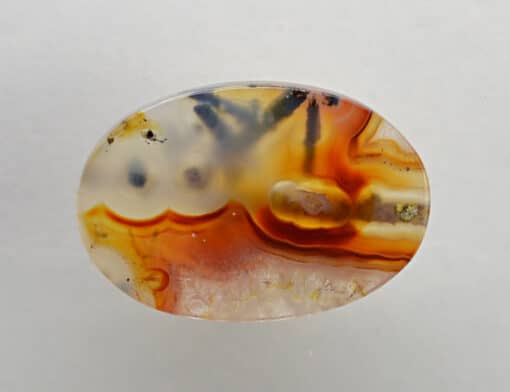 A piece of agate with a yellow and orange design.