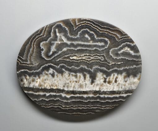A black and white agate plate on a white surface.