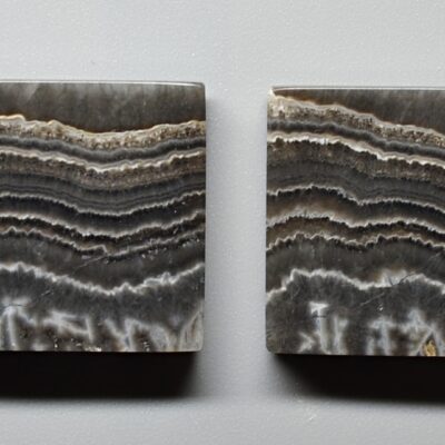 Two pieces of agate on a white surface.