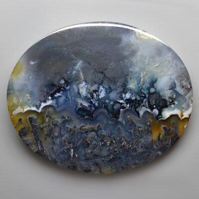 A blue and yellow agate plate on a white surface. Purchase Gems to get a Discount.