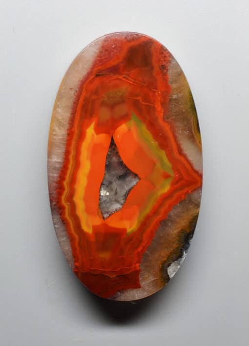 An orange and yellow agate on a white background.
