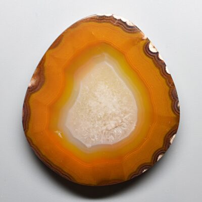 A slice of agate on a white surface.