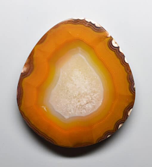A slice of agate on a white surface.
