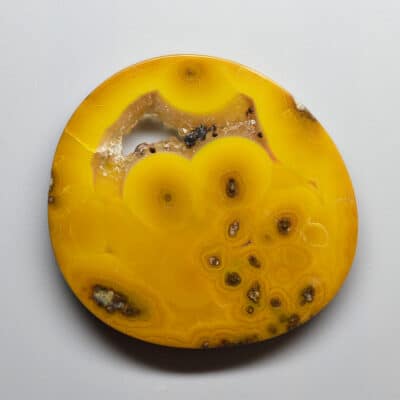 Yellow agate on a white surface.