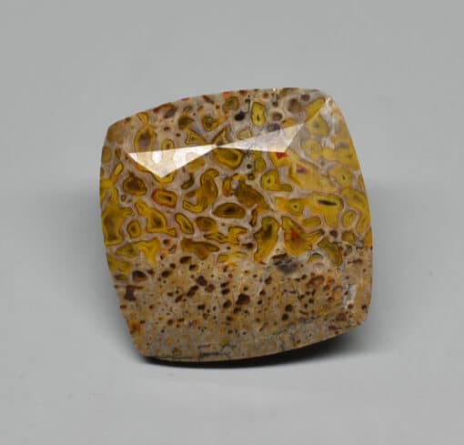 A yellow and brown stone cabochon.