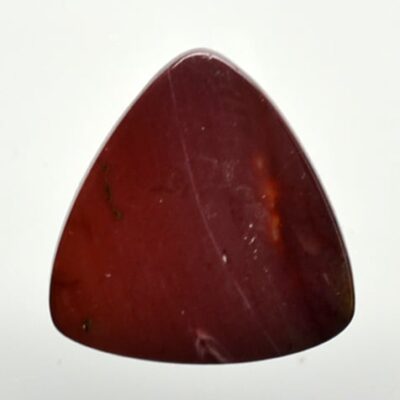 A piece of red jasper on a white background.