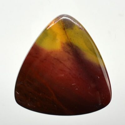 A triangular piece of red, yellow and green agate.