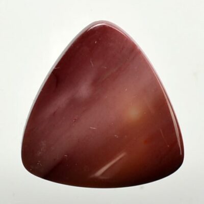 A piece of red jade on a white background.