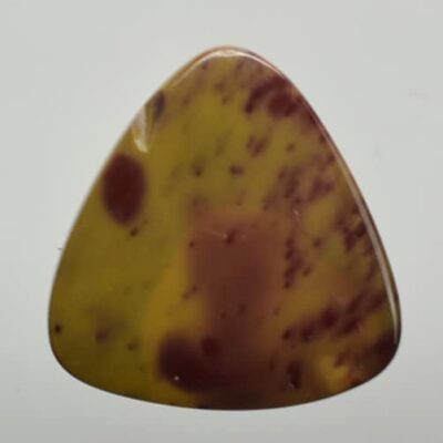 A yellow and brown agate triangle on a white background.