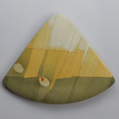 A triangular piece of art with a yellow and green design.