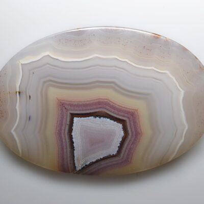 A round piece of agate on a white background.