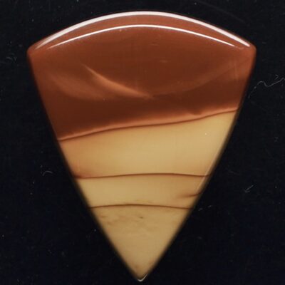 A triangle shaped piece of brown and white marble.