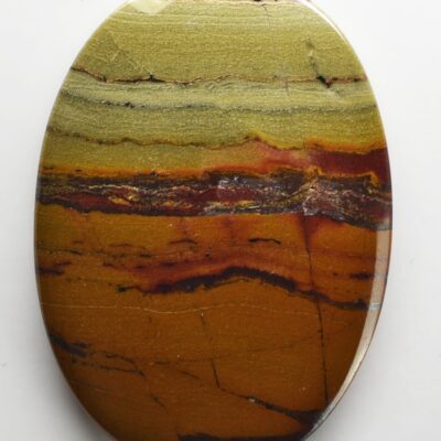 A round piece of yellow and brown jasper.