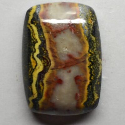 A square piece of yellow and black agate.