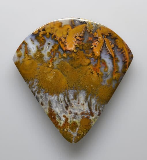 A triangular shaped piece of agate.