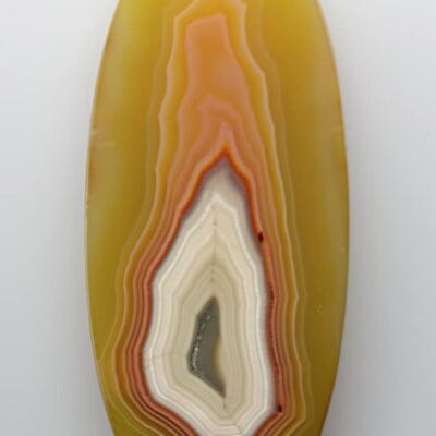 A yellow and orange agate on a white background.