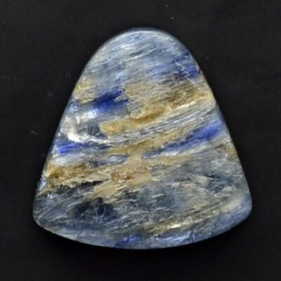 A blue and gold stone on a black surface.