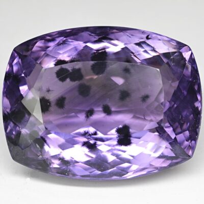 A cushion cut purple amethyst gemstone.