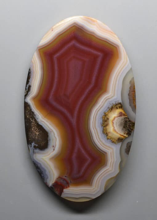 A red and brown agate on a white background.
