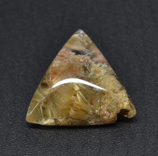 A triangular shaped piece of yellow quartz.