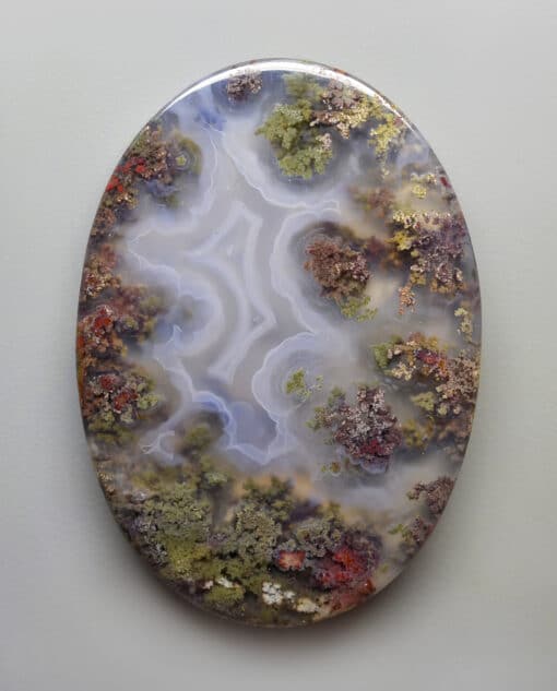 A piece of agate with moss on it.