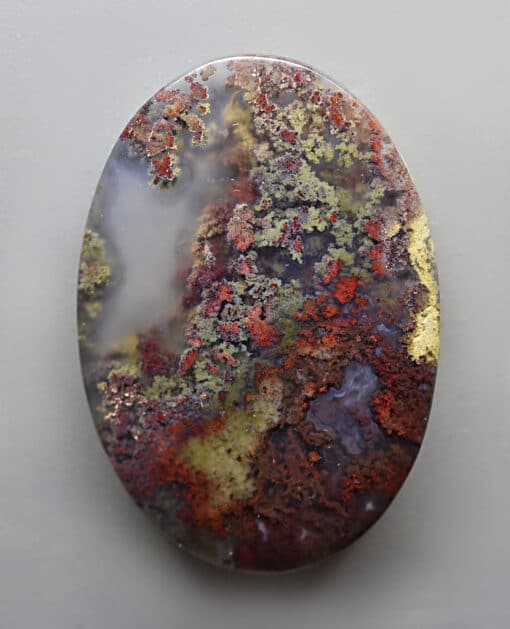 A piece of agate with moss on it.