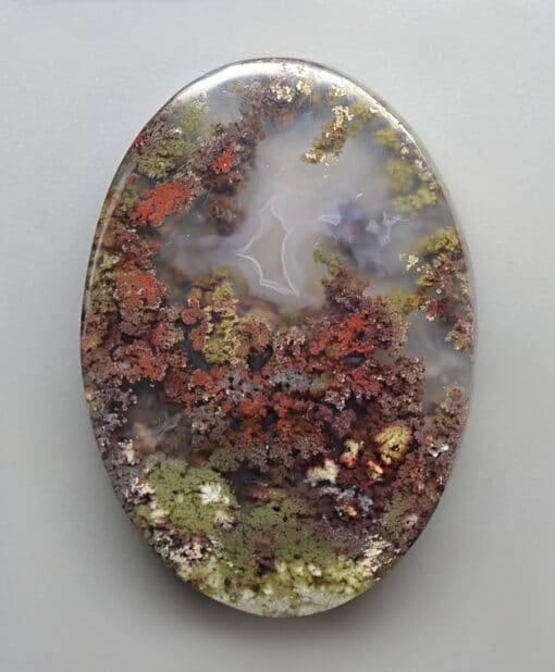 A piece of agate with moss on it.