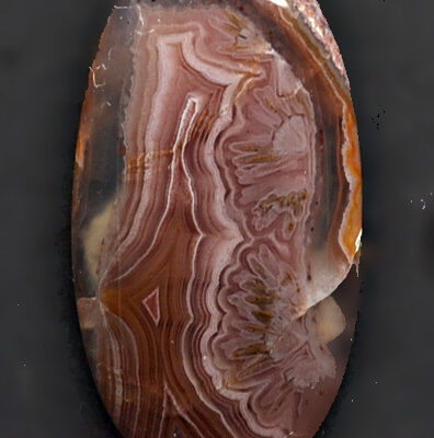 A brown and red agate on a black background.
