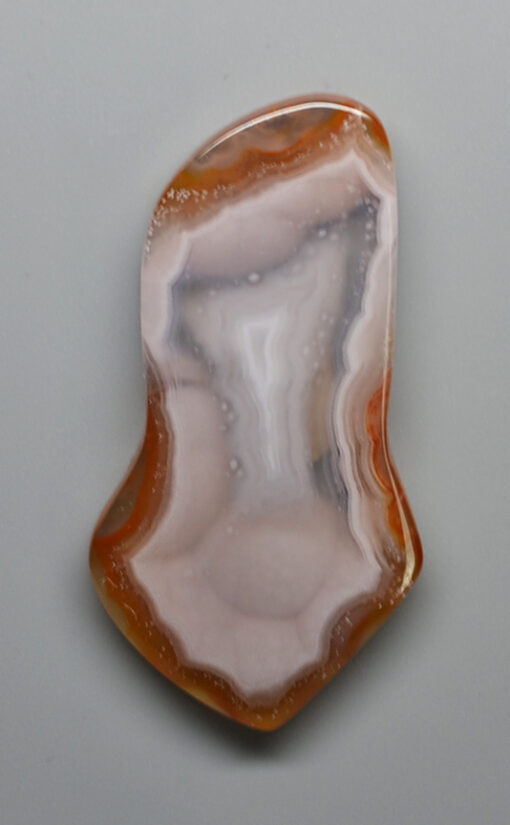 A piece of agate on a white surface.