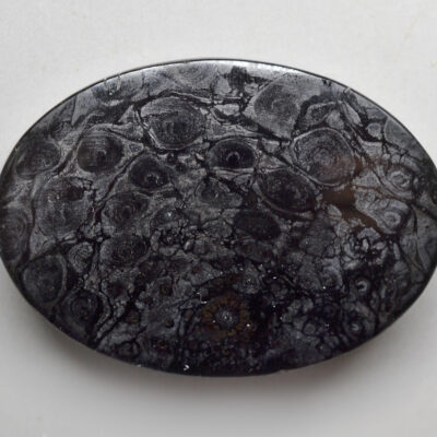 A black and white stone with a pattern on it.