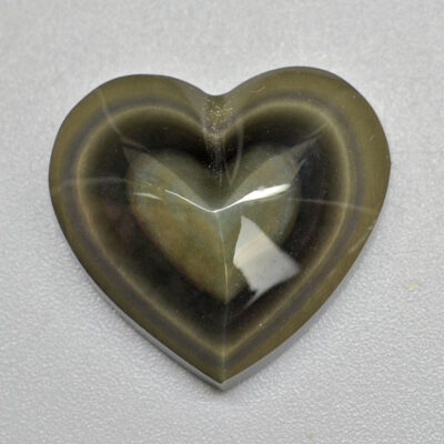 A heart shaped piece of green agate.