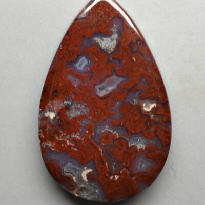 A red and blue agate tear shaped pendant.