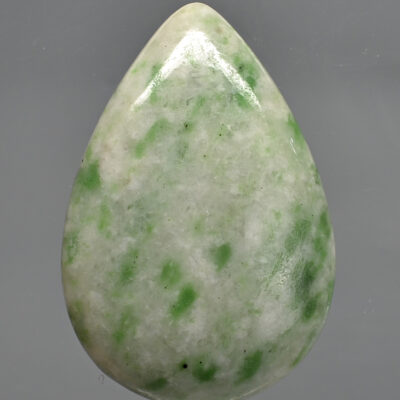 A green jade tear shaped stone.