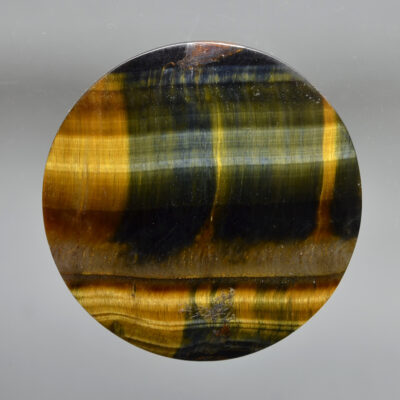 A tiger's eye stone on a white background.