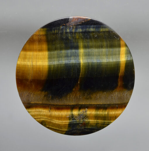 A tiger's eye stone on a white background.