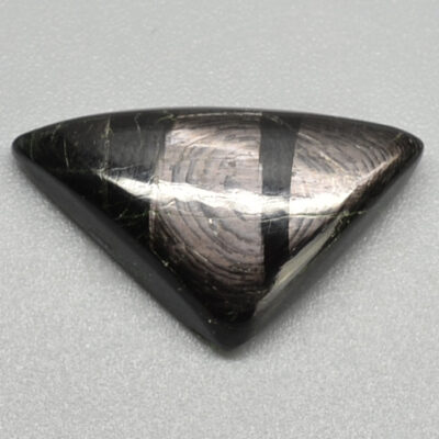 A black and white triangle shaped stone.