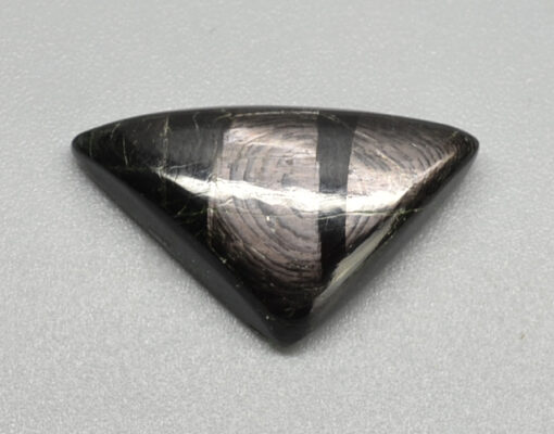 A black and white triangle shaped stone.