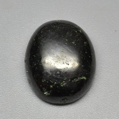 A black oval shaped stone.