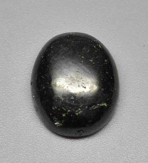 A black oval shaped stone.