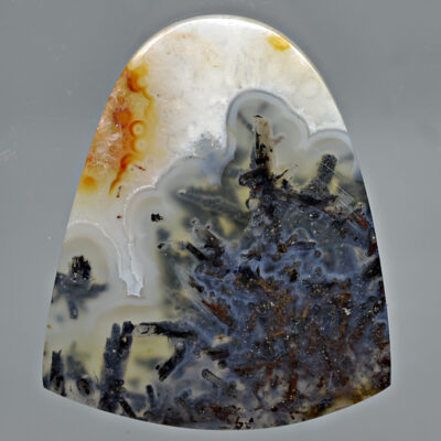 A piece of Trent Agate with Stibnite 36.42 ct Fancy Cabochon 40.00 x 22.50 mm y90878 with a black and white pattern.