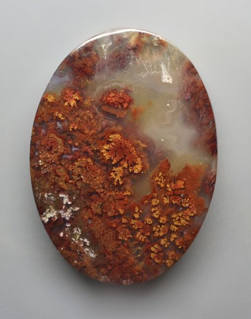 An Indonesian Moss Agate 36.93 ct Oval Cabochon 35.00 x 25.40 x 5.20 mm max3150 with orange and white specks.