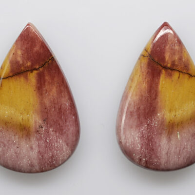 A pair of red and yellow tear shaped stones.