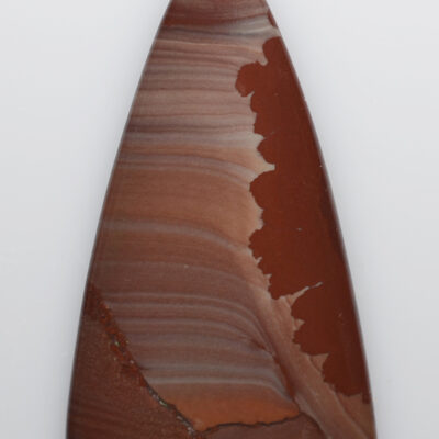 A triangular piece of brown agate on a white background.