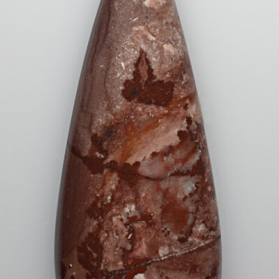 A piece of brown jasper on a white background.