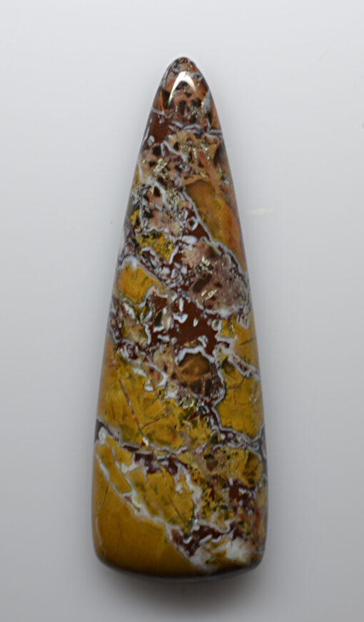 A yellow and brown stone pendant on a white background.