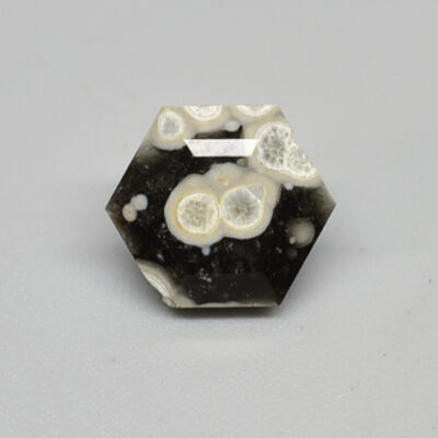 A black and white hexagonal apatite stone.